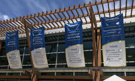 Four Sonoma State University banners displaying pillars: Student Success, Academic Excellence, Leadership Cultivation, and Transformative Impact.